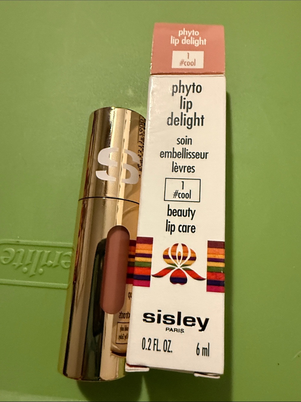 Lip product on green surface